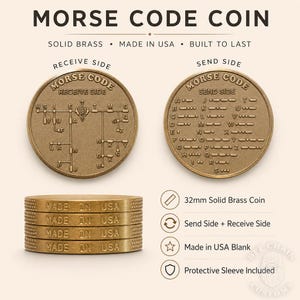 May include: A 32mm solid brass Morse code coin featuring a receive side with a branching letter chart and a send side with an alphabet and dot-dash key. The edge of the stacked coins is embossed with the text MADE IN USA. The design is metallic gold.