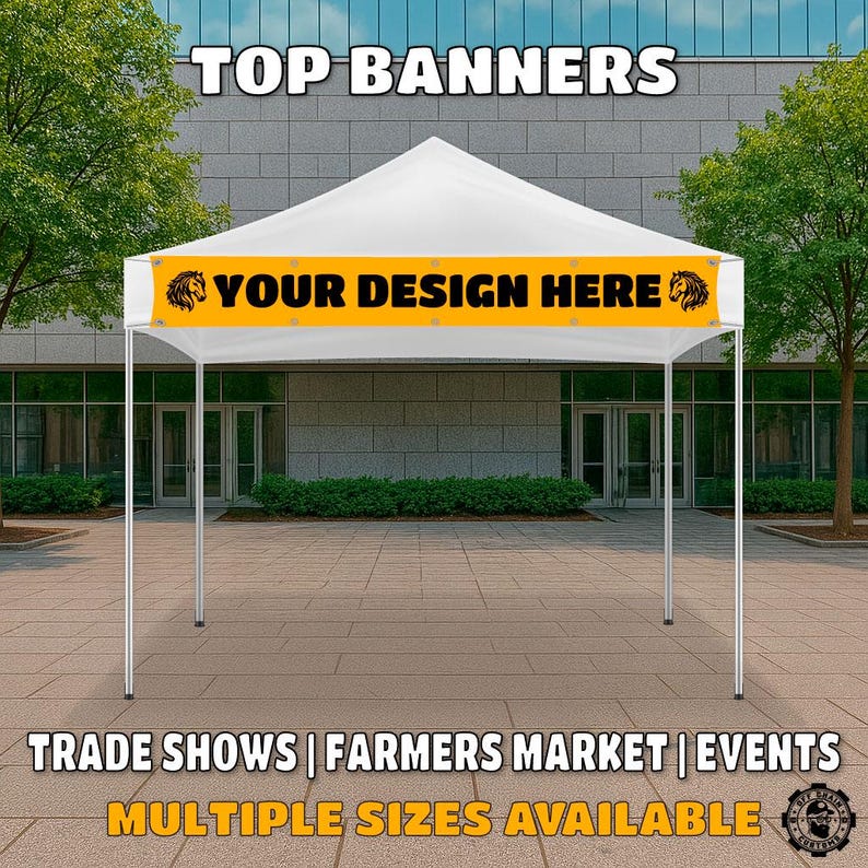 May include: White canopy tent with a yellow banner that says "YOUR DESIGN HERE" with a lion graphic on each side. The banner is for trade shows, farmers markets, and events. Multiple sizes are available.
