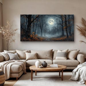 May include: A canvas print of a foggy forest scene with a full moon in the sky. The trees are bare and the ground is covered in fallen leaves.