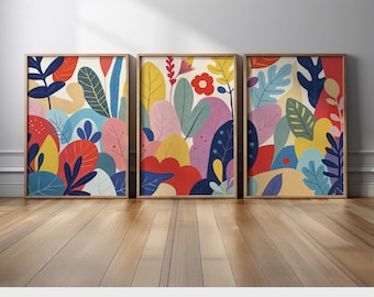 May include: Three framed prints with a colorful abstract design featuring a variety of shapes and colors, including red, yellow, blue, green, and purple. The design resembles a stylized floral pattern.