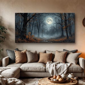May include: A painting of a moonlit forest with a full moon shining through the trees. The forest is dark and mysterious, with fog swirling around the trees. The painting is framed and hanging on a wall in a living room.