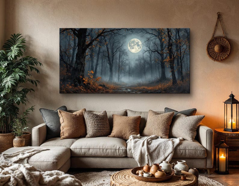May include: A painting of a moonlit forest with a full moon shining through the trees. The forest is dark and mysterious, with fog swirling around the trees. The painting is framed and hanging on a wall in a living room.