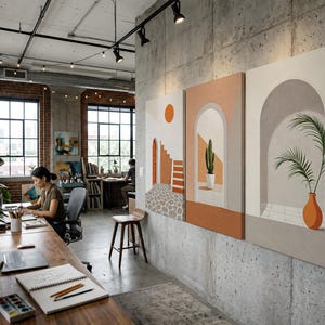 May include: Three rectangular wall art panels featuring architectural illustrations. The first shows a sun, stairs, and stone path. The second depicts a cactus in an archway. The third displays a potted palm plant within a beige arched alcove.