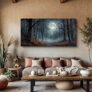 May include: A canvas print of a misty forest scene with a full moon hanging in the sky. The trees are silhouetted against the moon and the fog.