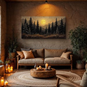 May include: A living room interior with a brown leather sofa, a wooden coffee table, and a large canvas print of a moonlit forest scene. The room is decorated with candles and plants.