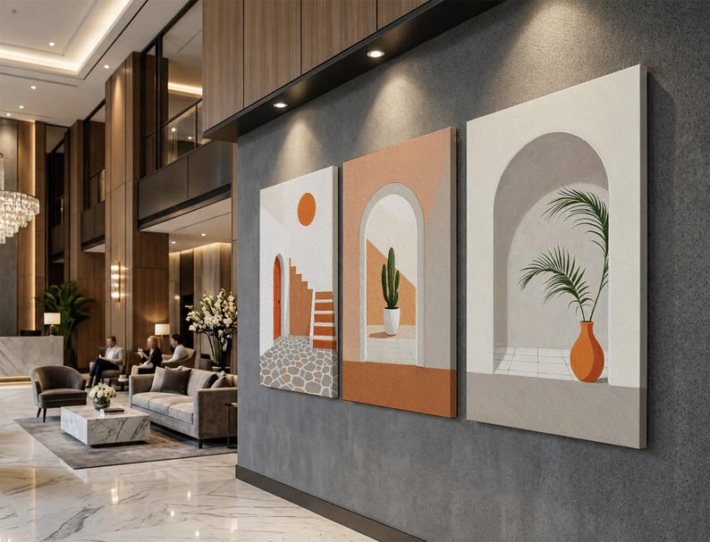 May include: A set of three rectangular canvas wall art prints featuring architectural scenes. The designs include a stone courtyard with stairs and a sun, a cactus in an arched doorway, and a potted palm plant inside a white arched alcove.