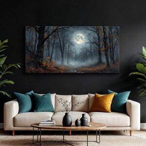 May include: A canvas print of a moonlit forest scene with a full moon in the center of the image. The forest is dark and mysterious, with tall trees and fog. The moon is bright and white, casting a soft glow on the forest floor.