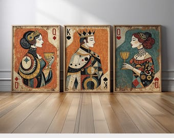 May include: Three framed wall art prints featuring stylized playing card illustrations. The left print shows a Queen of Diamonds, the center a King of Spades, and the right a Queen of Hearts. Each figure holds a golden chalice against a textured background.