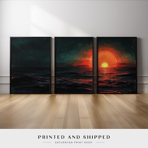 May include: Three framed art prints depicting a sunset over the ocean. The artwork features dark blues and greens with vibrant orange and red hues. The text "PRINTED AND SHIPPED" is visible at the bottom.