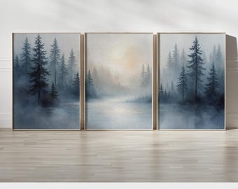 May include: Three framed landscape art prints depicting a misty forest scene with tall evergreen trees and a body of water. The artwork features a muted color palette of blues, grays, and whites, creating a serene and atmospheric aesthetic. The text "PRINTED AND SHIPPED" is at the bottom.