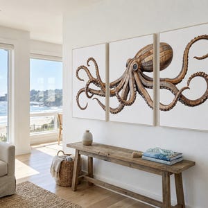 May include: A triptych wall art set featuring a large octopus illustration composed of brown wooden plank textures against a plain white background. The octopus spans across three separate rectangular framed panels, displaying detailed suckers and curved tentacles.
