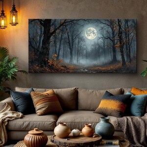 May include: A canvas print of a misty forest scene with a full moon hanging in the sky. The trees are silhouetted against the moon and the fog creates a sense of mystery.