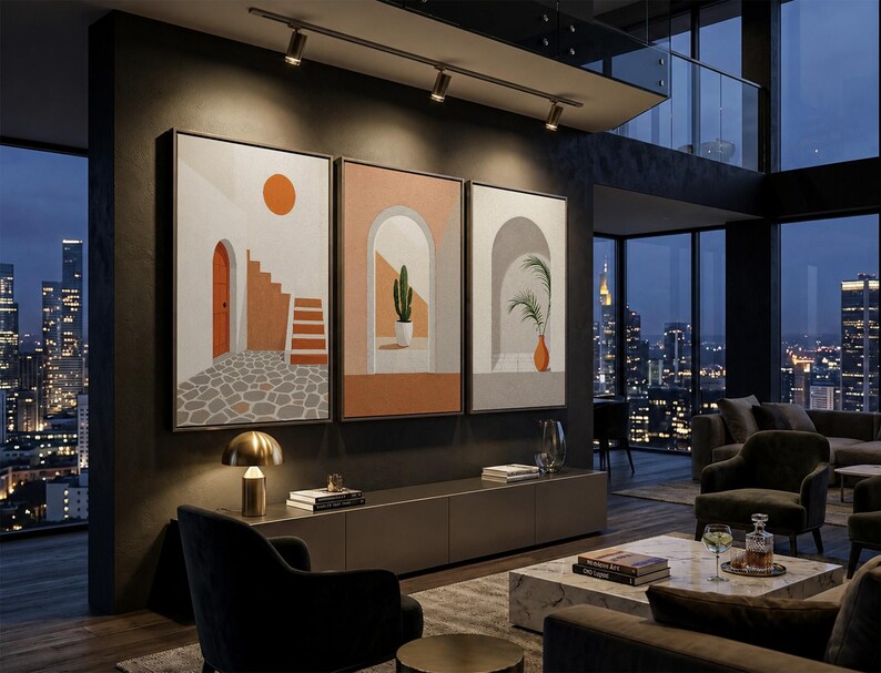 May include: A triptych of framed wall art prints featuring architectural scenes with arches, a cactus, a potted plant, and a sun, displayed on a dark wall above a long media console in a modern living room with floor-to-ceiling windows.
