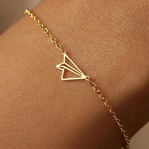 Armband med pappersflygplan i 24k guld