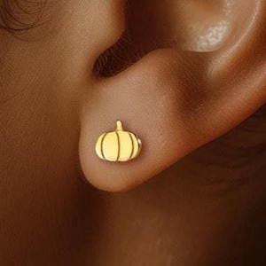 May include: A white ceramic mug with a black handle and the text "But First, Coffee" in a black, bold font. The mug is on a white surface.