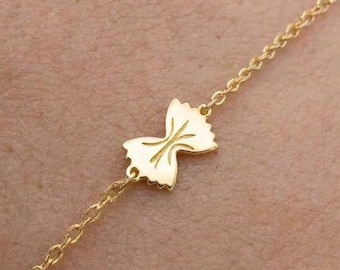 Bracciale a forma di farfalla in oro 24 carati