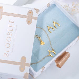 a box that has a necklace in it