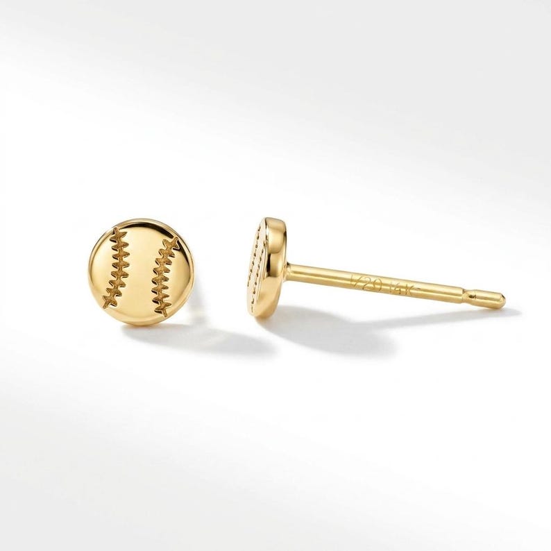 Gold baseball earrings shown front and side on white, revealing the stamped stud post