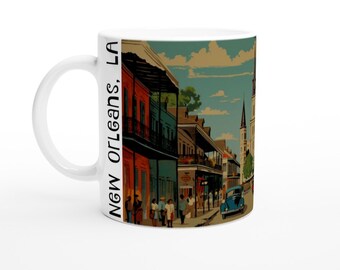 May include: White ceramic mug with a colorful illustration of a street scene in New Orleans, Louisiana. The text "NEW ORLEANS, LA" is printed on the side of the mug.