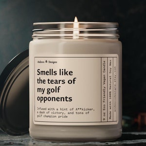 a funny candle that says smells like the tears of my golf opponents - infused with a hint of A**kicker, a dash of victory and tons of golf champion pride