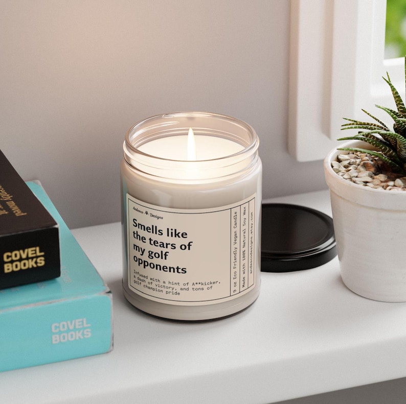 a funny candle that says smells like the tears of my golf opponents - infused with a hint of A**kicker, a dash of victory and tons of golf champion pride
