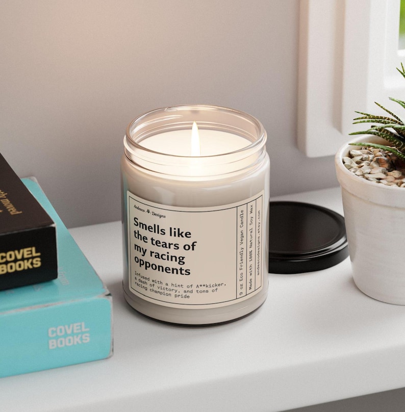 a funny candle that says smells like the tears of my racing opponents - infused with a hint of A**kicker, a dash of victory, and tons of racing champion pride.