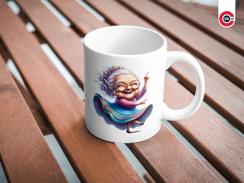May include: White ceramic mug featuring a colourful illustration of a smiling woman with grey hair wearing a colourful skirt and glasses. She is dancing with her arms raised.