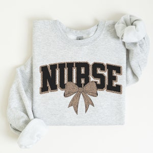 Coquette Leopard Nurse Sweatshirt, Registered Nurse Bow Shirt, Nurse Life Sweater, New Nurse Graduation Gift, School Nursing Tee Gift for RN