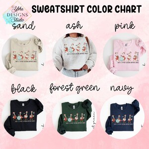May include: Sweatshirt color chart featuring six different sweatshirt colors: sand, ash, pink, black, forest green, and navy. Each sweatshirt displays a cartoon design of geese with the text "THAT'S IT I'M NOT CATCHING ANYMORE GRAPES."