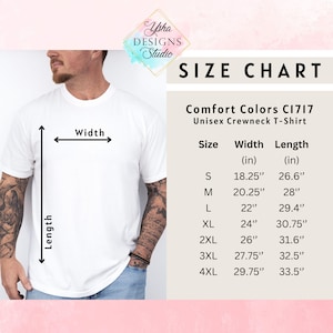 May include: A white Comfort Colors C1717 unisex crewneck t-shirt. The image includes a size chart with measurements in inches for sizes S through 4XL. The shirt is being measured for width and length.