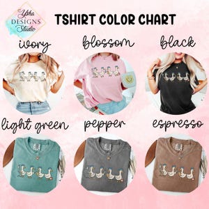 May include: T-shirt color chart featuring six different t-shirt colors: ivory, blossom, black, light green, pepper, and espresso. Each shirt displays a graphic of geese wearing hats. The text "TSHIRT COLOR CHART" is at the top, with the Ysha Designs Studio logo in the upper left corner.