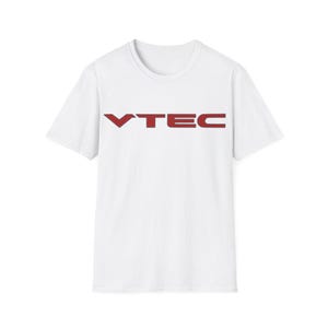 May include: White t-shirt with a red "VTEC" logo printed on the front.