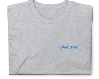 May include: A gray t-shirt with a blue embroidered logo that says "del Sol".