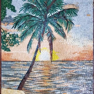May include: A rectangular mosaic wall art piece depicting a tropical beach scene with a palm tree in the foreground, a setting sun on the horizon, and ocean waves in shades of blue and grey. The sandy shore is rendered in light beige tiles.