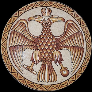 May include: Circular mosaic featuring a double-headed eagle, a crown, and a scroll. The eagle is brown with detailed feathering, holding a scroll and orb. The border has a repeating triangle pattern in brown and tan.