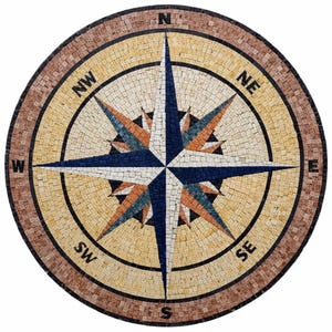 May include: A circular stone mosaic featuring a compass rose design with a central star in shades of navy blue, white, and orange. The outer border is a warm brown tone, and the cardinal directions N, S, E, W, NW, NE, SW, SE are clearly marked.