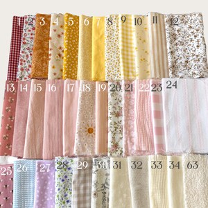 May include: A collection of fabric swatches arranged in rows, numbered 1 through 34 and 63. The textiles feature various patterns including floral, gingham, stripes, and solid colors in shades of red, yellow, pink, blue, purple, and cream.