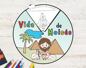 Könnte beinhalten: Ein farbenfrohes, illustriertes Lernrad mit dem Text "Vida de Moisés" (Leben des Moses). Das Bild enthält Zeichnungen von Moses, Pyramiden, Schafen und einer Palme. Der obere Abschnitt lautet "El nacimiento de Moises" (Die Geburt des Moses).