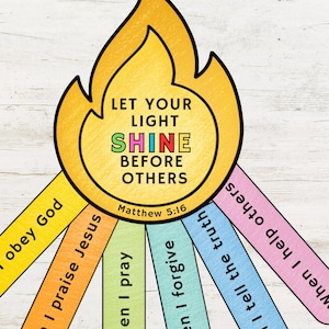 May include: A colorful illustration with a flame-shaped design. The text reads "LET YOUR LIGHT SHINE BEFORE OTHERS" with "Matthew 5:16" below. Attached are colorful strips with phrases like "I obey God" and "I praise Jesus".