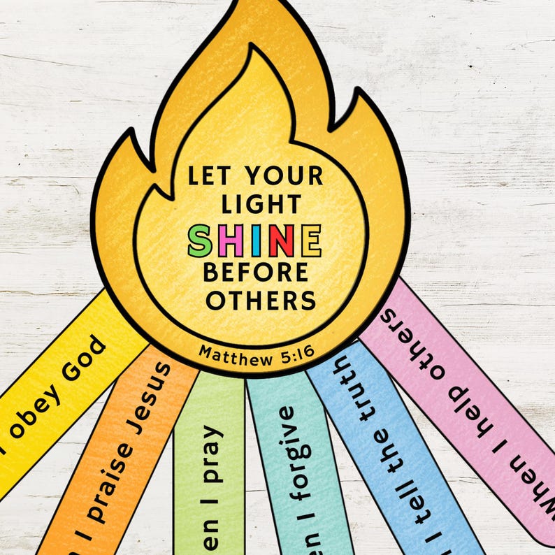 May include: A colorful illustration with a flame-shaped design. The text reads "LET YOUR LIGHT SHINE BEFORE OTHERS" with "Matthew 5:16" below. Attached are colorful strips with phrases like "I obey God" and "I praise Jesus".