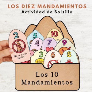 May include: A colorful educational activity set titled "The Ten Commandments." The set includes numbered cards with illustrations and Spanish text. The cards are held in a brown container with the title "Los 10 Mandamientos."