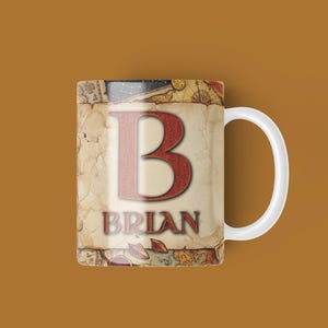 May include: White ceramic mug with a large red letter "B" and the name "Brian" in red. The mug's design features a vintage map theme with a cream background and a white handle.