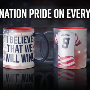 May include: Two ceramic mugs with patriotic designs. One mug features the text "I BELIEVE THAT WE WILL WIN!" over a flag design. The other mug displays a jersey with the name "SMITH" and the number "9". The mugs have a red interior and a dark blue handle.