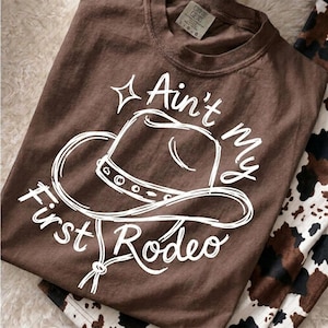 Aint My First Rodeo Svg, Western Cowboy Hat Png, Summer Vacation Graphic Tee, Trending Catchphrase Girly Boutique Sublimation Cut File DTF