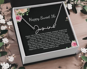 May include: A silver necklace with the name "Jasmine" inscribed on it, presented in a gift box with a floral design and a message wishing a happy 16th birthday. The message reads, "Happy 16th birthday to the smartest, sweetest, kindest soul who's grown into the most wonderful young woman in the universe! The light of your loving heart spreads joy wherever you go - you make this world a better place just by being you. I hope you never change for anyone, never stop being yourself. You are 16 only once and I hope that this special milestone of yours is as beautiful as you are! Wherever life may lead you, I wish you find never-ending happiness. No matter what happens, never forget how truly deeply loved you are!"