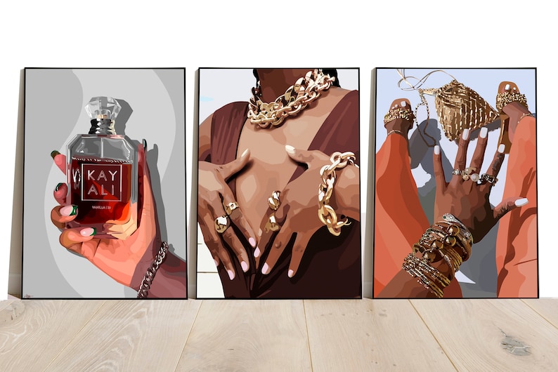 May include: Triptych of art prints featuring illustrations of fashion and beauty. One print shows a perfume bottle with the text "KAY ALI". The other two prints depict hands adorned with gold jewelry, including rings, bracelets, and necklaces.
