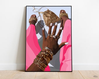 May include: A woman's hand with gold rings and bracelets, wearing pink pants and gold sandals. A gold woven bag is on the floor.