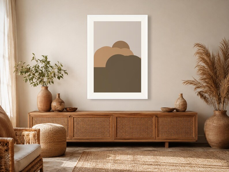 Puede incluir: Una impresi&oacute;n de arte mural rectangular que presenta una serie de formas abstractas redondeadas y superpuestas en tonos beige, canela y marr&oacute;n oscuro, sobre un fondo gris claro y dentro de un marco blanco simple y limpio.