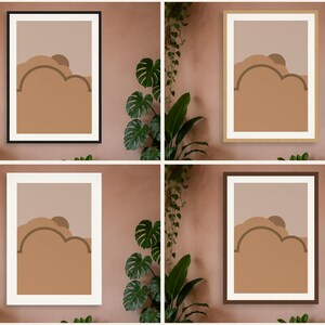 May include: Four framed wall art prints featuring a geometric landscape design with a sun and clouds in shades of tan, brown, and beige. The prints are displayed in black, light wood, white, and dark brown frames, each with a white mat border.