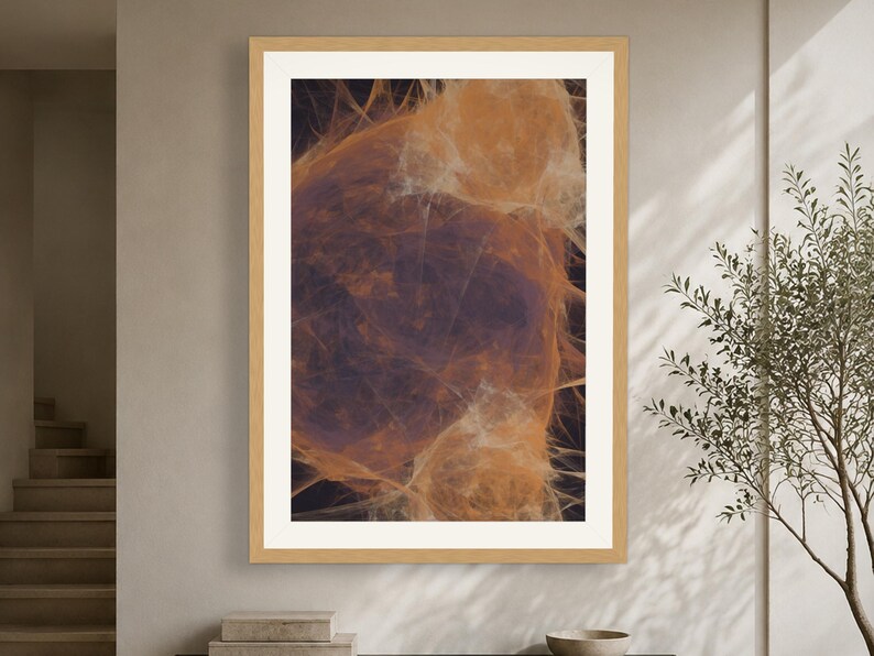 May include: A framed wall art print featuring an abstract composition of swirling, translucent orange and amber filaments set against a deep, dark purple background, enclosed within a light-toned wooden frame with a wide white mat border.